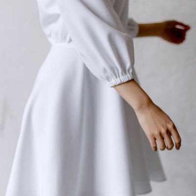 Silhouette of a person in a balanced, flowing pose against a soft light.